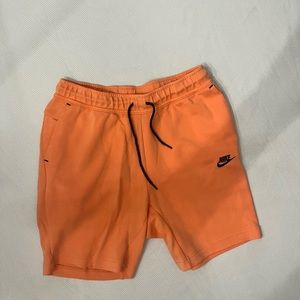 Pink Nike tech shorts